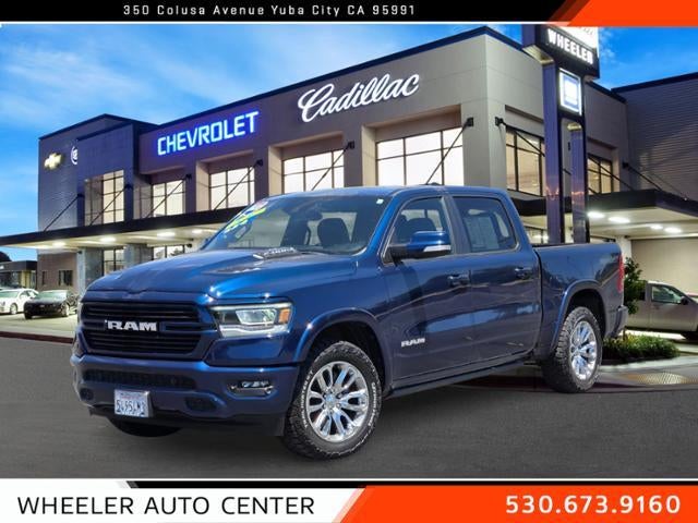 2022 RAM 1500 Laramie 4x4 Crew Cab 5'7" Box in Patriot Blue Pearlcoat — front three-quarter view