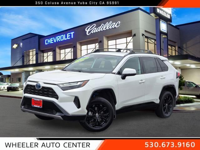 2022 Toyota RAV4 Hybrid SE AWD (Natl) in Blizzard Pearl — front three-quarter view